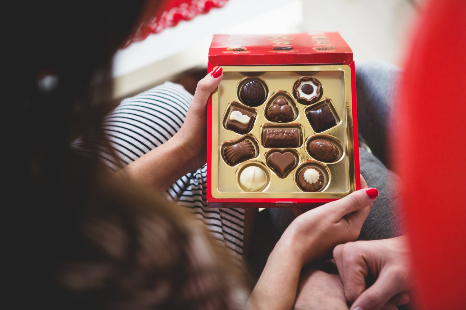 woman-opening-box-chocolates.jpg